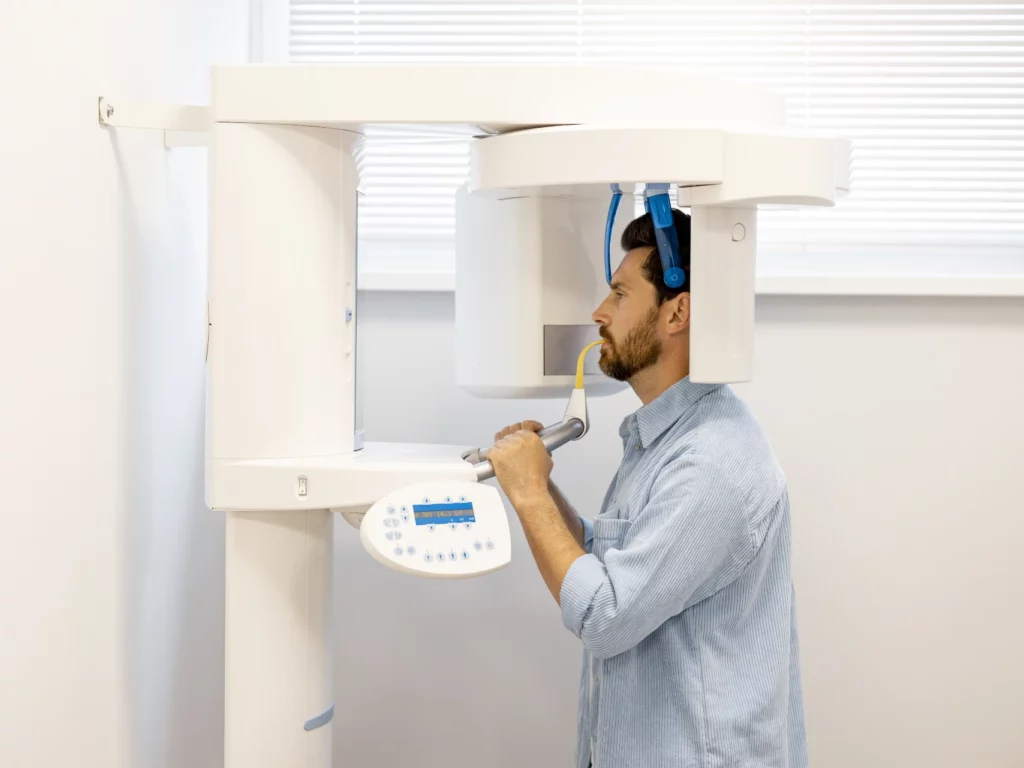 man doing CBDanbury 3D x-ray at dental office